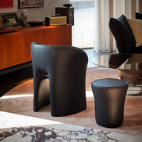 Sustainable armchair and side table in the living room.