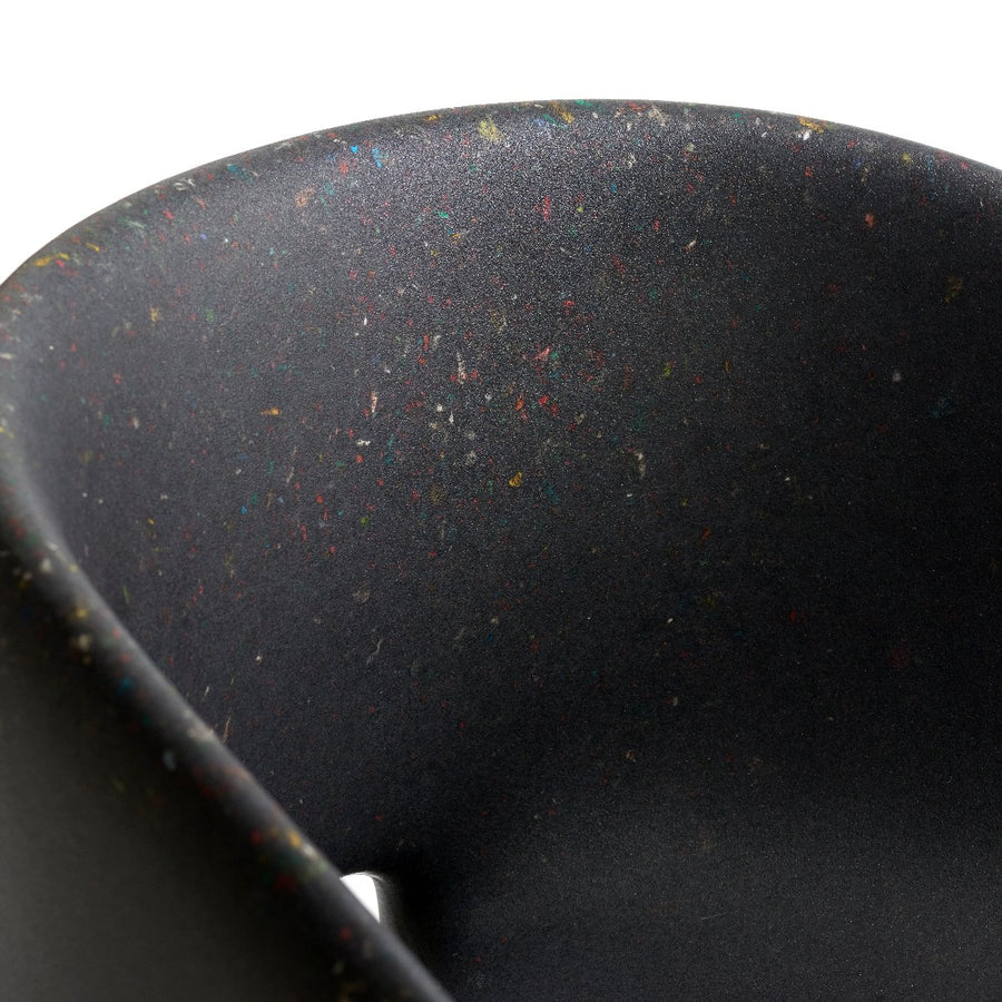 ecoBirdy Richard Chair Colour Shadow detail shot. Showing it's dark, black colour with speckled pattern.