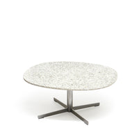 Frost Table by ecoBirdy is a nice salon table to place in the living room. The top has a unique pattern as a result of the recycling process.