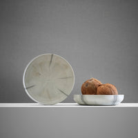 ecoBirdy Mabo Plate in the colour Sesame. It is a deep plate which has a pattern like marble.