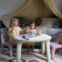 Painting at the best kids' table and chair set by ecoBirdy. It is stain-proof and easy to clean