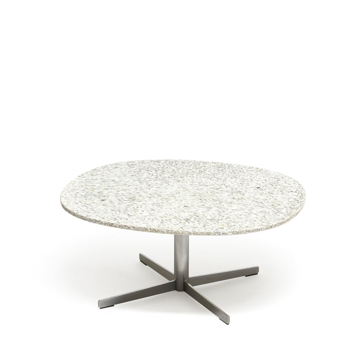 Frost Table by ecoBirdy is a nice salon table to place in the living room. The top has a unique pattern as a result of the recycling process. 